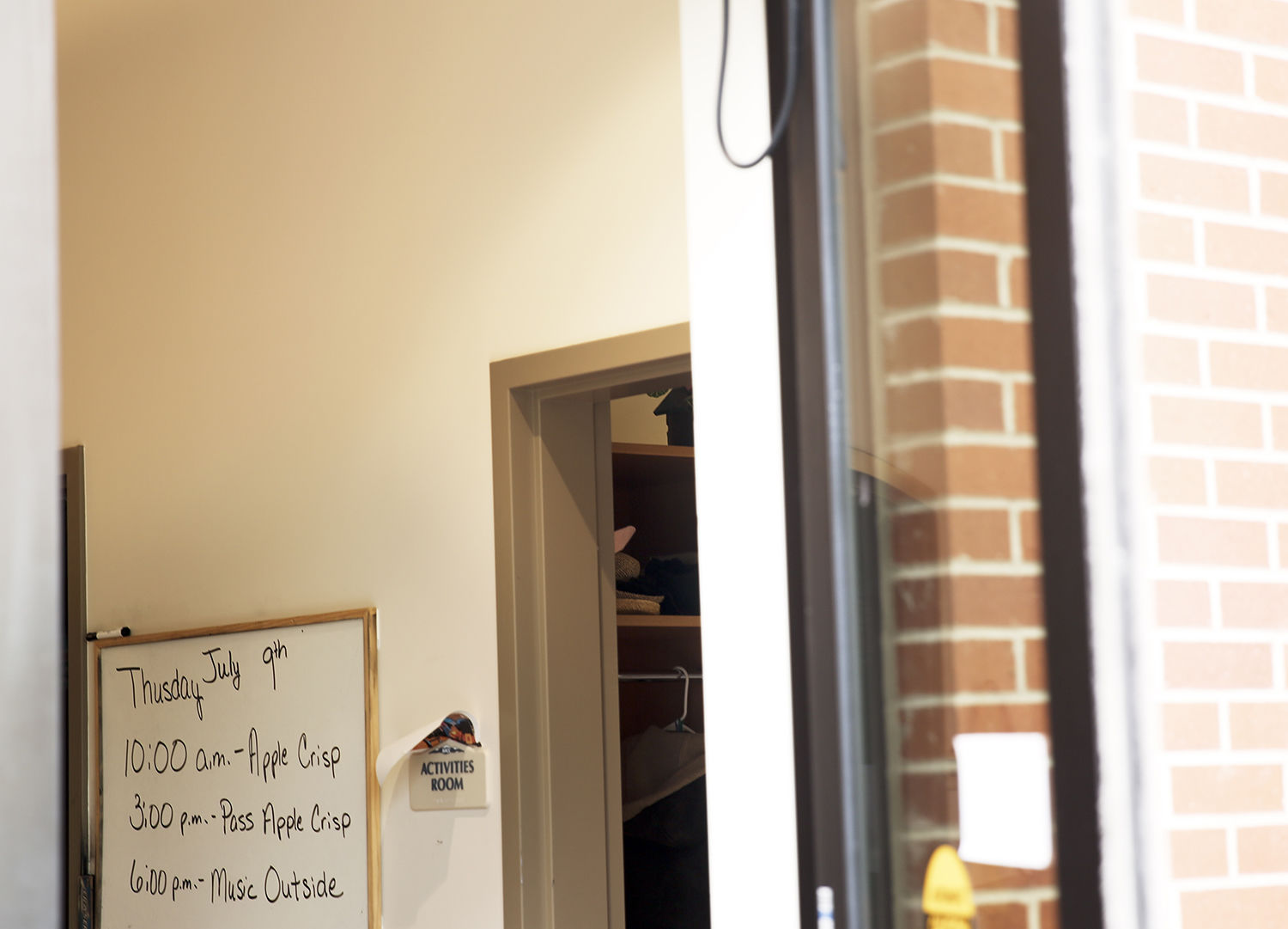Music time is noted on a whiteboard inside the Amie Holt dining room